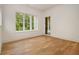 Bright bedroom with hardwood floors, large window, and views to the backyard at 4757 Lake Forrest Drive Northwest Dr, Atlanta, GA 30342