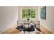Cozy dining area with a round table, stylish chairs, and a large window providing natural light at 4757 Lake Forrest Drive Northwest Dr, Atlanta, GA 30342