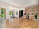 Open floor plan with dining area, wine bar, hardwood floors, and lots of natural light at 4757 Lake Forrest Drive Northwest Dr, Atlanta, GA 30342
