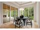 Bright dining room with a fireplace, a round table with chairs and an abundance of natural light at 4757 Lake Forrest Drive Northwest Dr, Atlanta, GA 30342