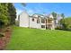 Stunning view of the modern home's exterior with a well-manicured lawn and beautiful architectural details at 4757 Lake Forrest Drive Northwest Dr, Atlanta, GA 30342