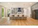 Bright, open kitchen with a large island, seating, stainless steel appliances, and gray cabinets at 4757 Lake Forrest Drive Northwest Dr, Atlanta, GA 30342