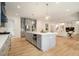 Spacious, modern kitchen with a large island, gray cabinets, and stainless steel appliances at 4757 Lake Forrest Drive Northwest Dr, Atlanta, GA 30342