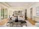 Spacious open concept living room with modern furniture, decor and view of the outdoor space at 4757 Lake Forrest Drive Northwest Dr, Atlanta, GA 30342