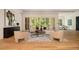 Bright living room featuring stylish furniture, hardwood floors, and scenic backyard views at 4757 Lake Forrest Drive Northwest Dr, Atlanta, GA 30342