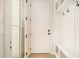 Bright mudroom with built-in storage, hooks and a bench seating area at 4757 Lake Forrest Drive Northwest Dr, Atlanta, GA 30342