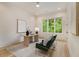 Bright office with a large window, a modern desk, and stylish decor at 4757 Lake Forrest Drive Northwest Dr, Atlanta, GA 30342