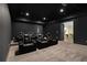 Home theater with plush seating, dark walls, and recessed lighting for an immersive experience at 4757 Lake Forrest Drive Northwest Dr, Atlanta, GA 30342