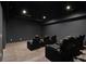 Home theater room featuring cozy black leather recliners for immersive entertainment at 4757 Lake Forrest Drive Northwest Dr, Atlanta, GA 30342