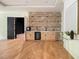 Entertainment space featuring a stylish wet bar with brick backsplash, cabinetry, and beverage cooler at 4757 Lake Forrest Drive Northwest Dr, Atlanta, GA 30342