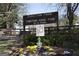 The Chastain Park entrance sign with flowers and mature trees welcoming visitors at 4757 Lake Forrest Nw Dr, Atlanta, GA 30342