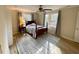 Bright bedroom with two windows, wood floors, and a neutral color scheme at 4774 Saint Bernard Sw Dr, Lilburn, GA 30047