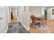 Inviting dining area with slate floors and an adjacent hardwood floor area at 4774 Saint Bernard Sw Dr, Lilburn, GA 30047