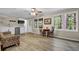 Finished basement with a kitchenette area, windows, and comfortable seating at 4774 Saint Bernard Sw Dr, Lilburn, GA 30047