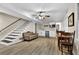 Finished basement with a kitchenette, new flooring, and a staircase at 4774 Saint Bernard Sw Dr, Lilburn, GA 30047