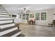 Finished basement with a kitchenette area, windows, and a staircase at 4774 Saint Bernard Sw Dr, Lilburn, GA 30047