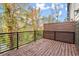 Back deck featuring horizontal wood privacy fence, metal railings, and views of the surrounding trees at 2333 Mason Dr # D26, Atlanta, GA 30316