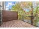 A spacious back deck offering privacy with a wooden fence and view of the surrounding trees at 2333 Mason Dr # D26, Atlanta, GA 30316