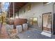 Backyard view featuring a private back patio, wood privacy fence, and exterior stairwell access at 2333 Mason Dr # D26, Atlanta, GA 30316