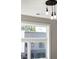 Bright bedroom showcasing modern pendant lights and a window with backyard views at 2333 Mason Dr # D26, Atlanta, GA 30316