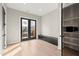 Bright bedroom with double doors to the patio, featuring hardwood floors and black trim at 2333 Mason Dr # D26, Atlanta, GA 30316