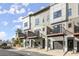 View of modern townhome exteriors with private garages, front doors, and deck areas at 2333 Mason Dr # D26, Atlanta, GA 30316