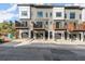 Modern townhome featuring private balconies, attached garages, and neutral-tone exterior at 2333 Mason Dr # D26, Atlanta, GA 30316