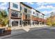View of modern townhome exteriors with private garages, front doors, and deck areas at 2333 Mason Dr # D26, Atlanta, GA 30316