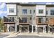 View of modern townhome exteriors with private garages, front doors, and deck areas at 2333 Mason Dr # D26, Atlanta, GA 30316