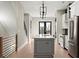 Modern kitchen boasts stainless appliances, a gray island, and chic lighting at 2333 Mason Dr # D26, Atlanta, GA 30316