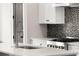 Close-up of modern kitchen's sink, faucet, and stainless steel appliances at 2333 Mason Dr # D26, Atlanta, GA 30316