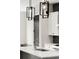 The modern kitchen features chic lighting fixtures and a stainless steel faucet at 2333 Mason Dr # D26, Atlanta, GA 30316