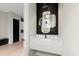 Chic powder room with floating vanity, designer mirrors, and modern lighting fixture at 2333 Mason Dr # D26, Atlanta, GA 30316