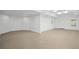 Unfinished basement features recessed lights and neutral concrete floors at 310 Ivy Brooke Ct, Atlanta, GA 30342