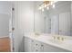 Bathroom boasts double vanity, gold hardware, and large mirror at 310 Ivy Brooke Ct, Atlanta, GA 30342