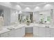 Bathroom with double sinks, a bathtub, and a view at 310 Ivy Brooke Ct, Atlanta, GA 30342