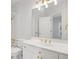 Bathroom boasts white vanity, gold hardware, and large mirror at 310 Ivy Brooke Ct, Atlanta, GA 30342