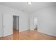 Bedroom features light gray walls, hardwood floors, and bathroom views at 310 Ivy Brooke Ct, Atlanta, GA 30342