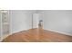 Bedroom with light gray walls, hardwood floors, and a view to the hall at 310 Ivy Brooke Ct, Atlanta, GA 30342