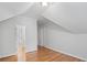 Bedroom features light gray walls, hardwood floors, and hallways at 310 Ivy Brooke Ct, Atlanta, GA 30342