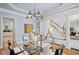 Sophisticated dining area transitions to living room and adjacent kitchen, perfect for entertaining at 310 Ivy Brooke Ct, Atlanta, GA 30342