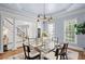 Elegant dining room with modern chandelier and windows providing natural light at 310 Ivy Brooke Ct, Atlanta, GA 30342
