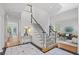 Grand foyer with black and white tile, staircase, and views of the living room and other spaces at 310 Ivy Brooke Ct, Atlanta, GA 30342