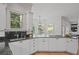 Well-lit kitchen featuring ample counter space, stainless steel sink, and gas stovetop at 310 Ivy Brooke Ct, Atlanta, GA 30342