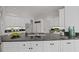 Bright kitchen features granite countertops and white cabinetry for a modern and clean look at 310 Ivy Brooke Ct, Atlanta, GA 30342