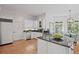Beautiful kitchen with stainless steel appliances, granite countertops, and an adjacent breakfast nook at 310 Ivy Brooke Ct, Atlanta, GA 30342