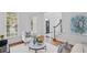 Cozy living room with hardwood floors, abundant natural light from windows, and stylish furnishings at 310 Ivy Brooke Ct, Atlanta, GA 30342