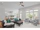 Open-concept living room flowing into the kitchen, featuring comfortable seating and ample natural light at 310 Ivy Brooke Ct, Atlanta, GA 30342