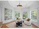 Bright sitting area with white chairs and views of the surrounding greenery at 310 Ivy Brooke Ct, Atlanta, GA 30342