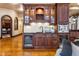 Wet bar with custom cabinetry, wine storage, and modern appliances at 3180 Mathieson Ne Dr # 1401, Atlanta, GA 30305